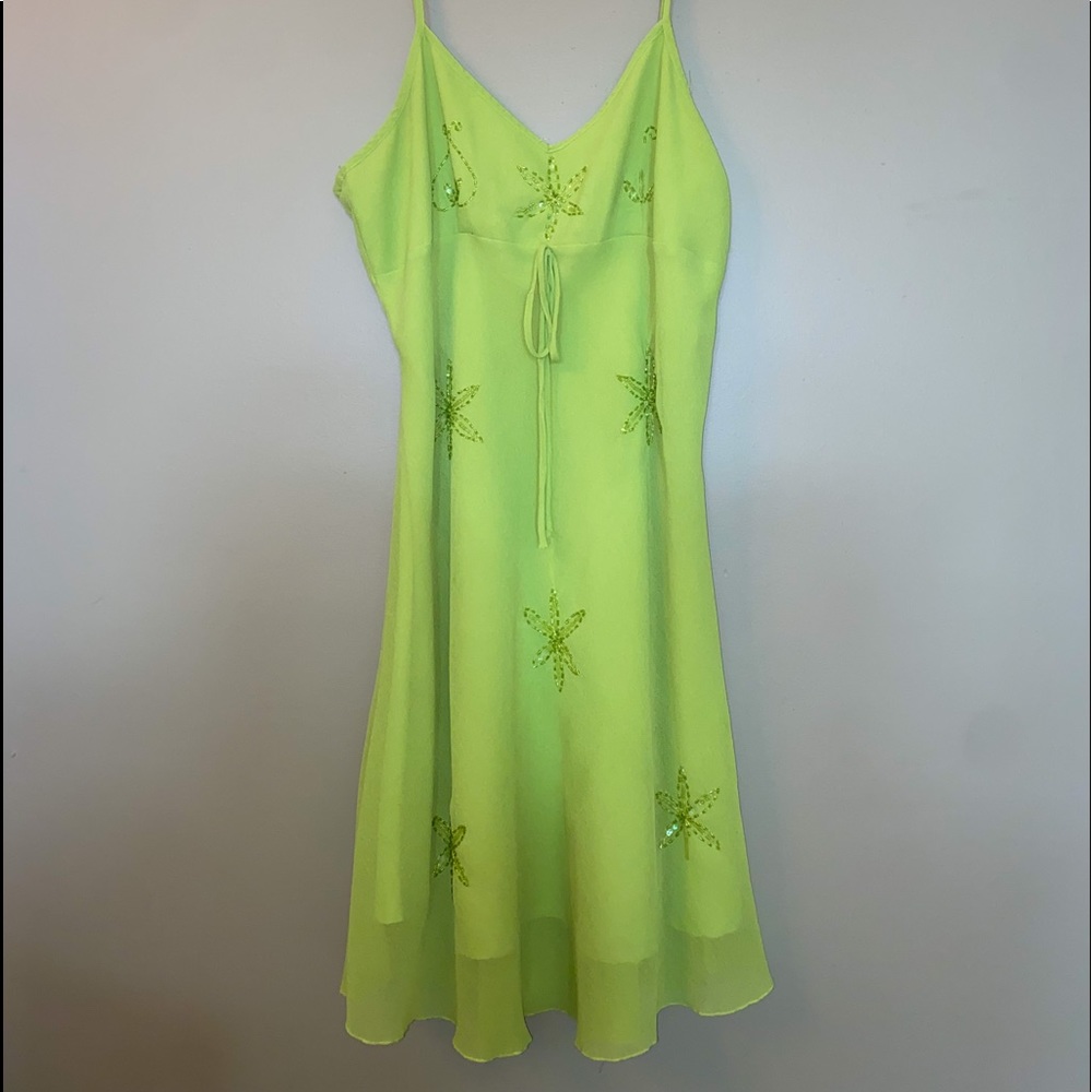 Glowing green dress with beaded flowers
